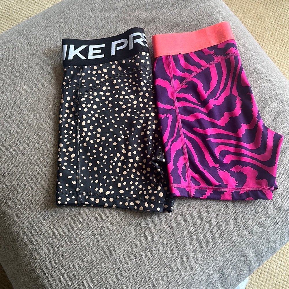 Two pairs of Nike spandex shorts, Nike pros